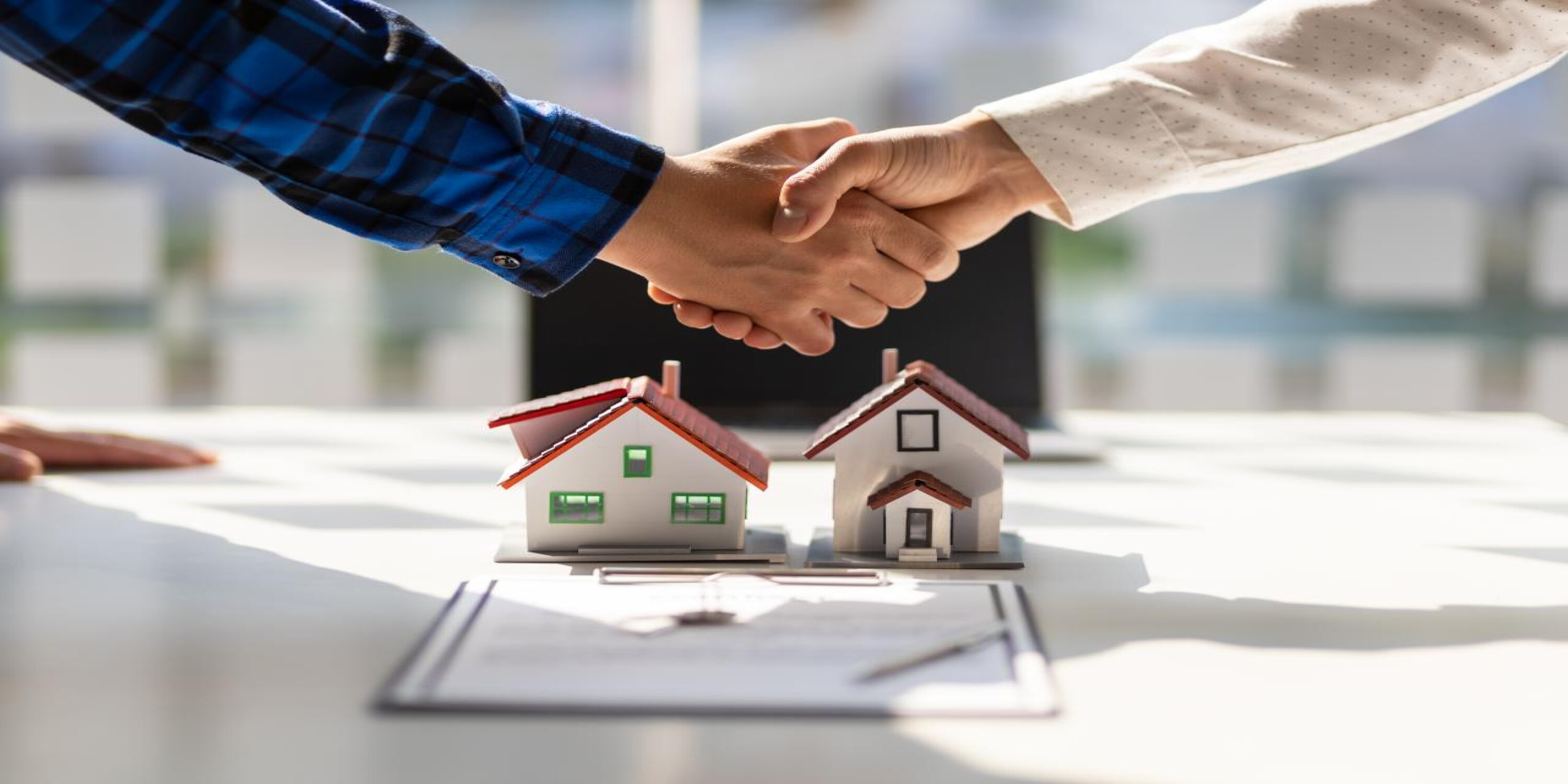 developer and owner shaking hands after obtaining NOC
